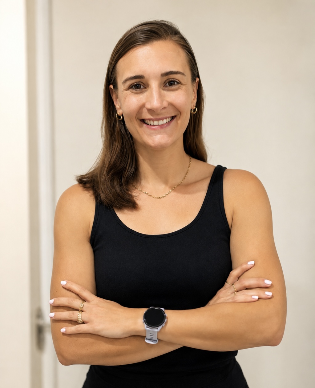 Tilana van Tonder smiling with her arms crossed